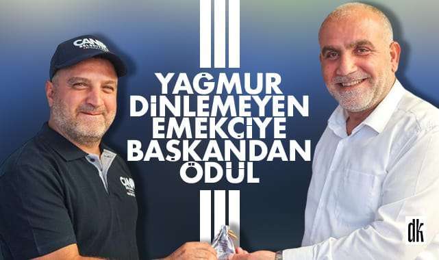 Yağmur dinlemeyen işçiye başkandan ödül